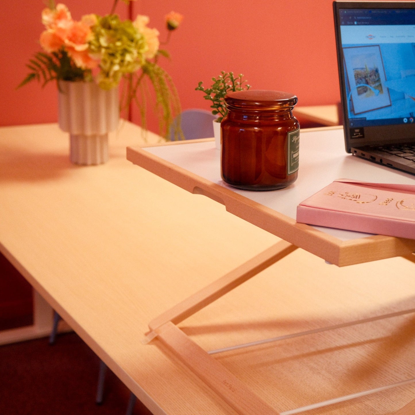 Freedesk Desk Riser Light Large on a dinner table.