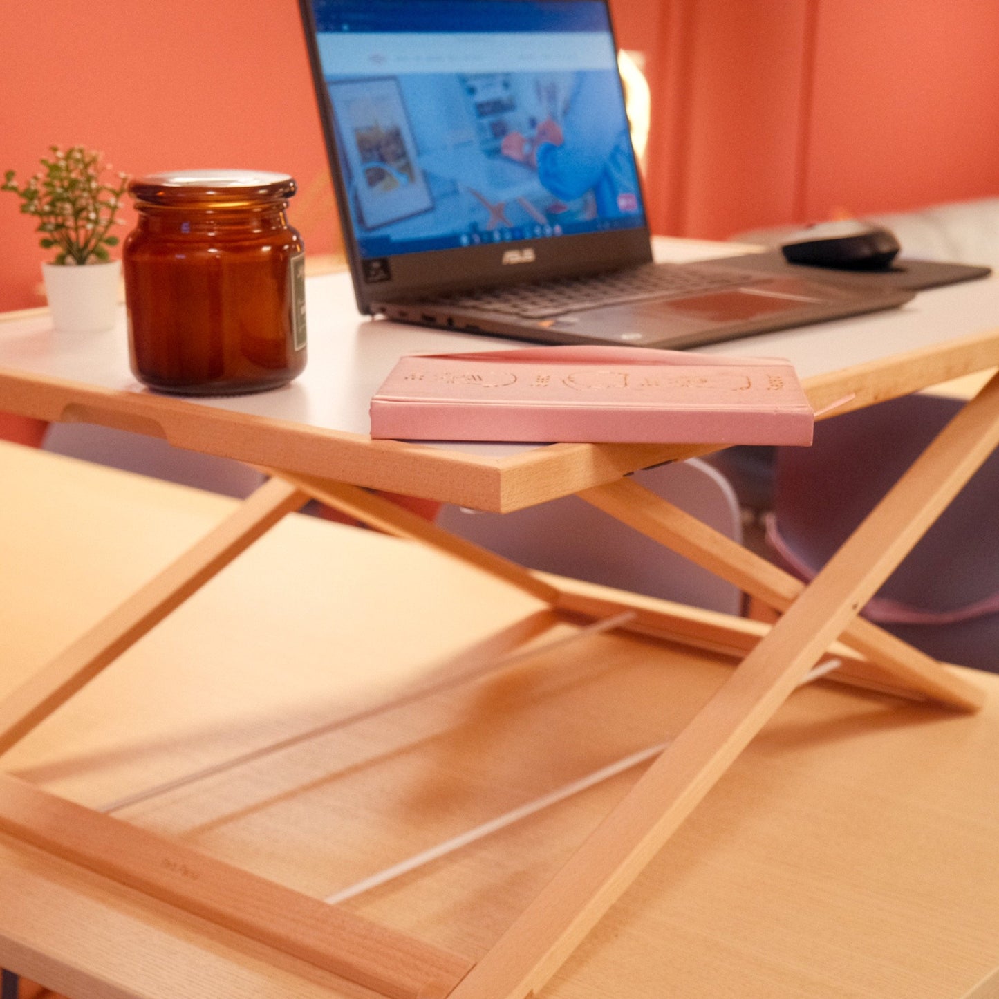Freedesk Desk Riser Light Large on a dinner table.