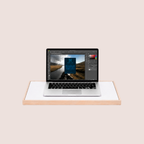 Laptop placed on a height & adjustable desk riser for a more ergonomic and comfortable working position