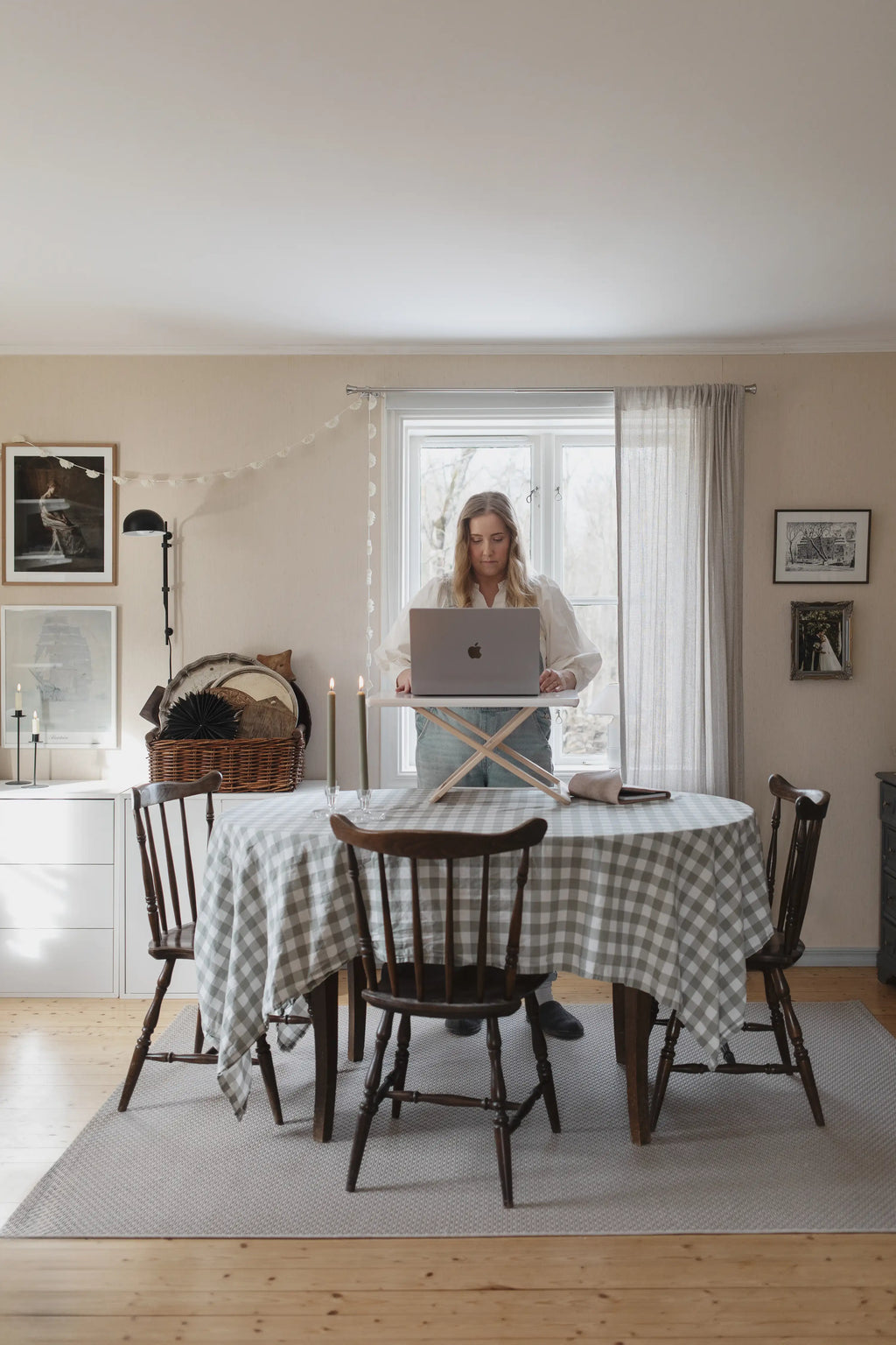Freedesk Desk Riser Original Compact on a dining table in a rustic home office setup with laptop