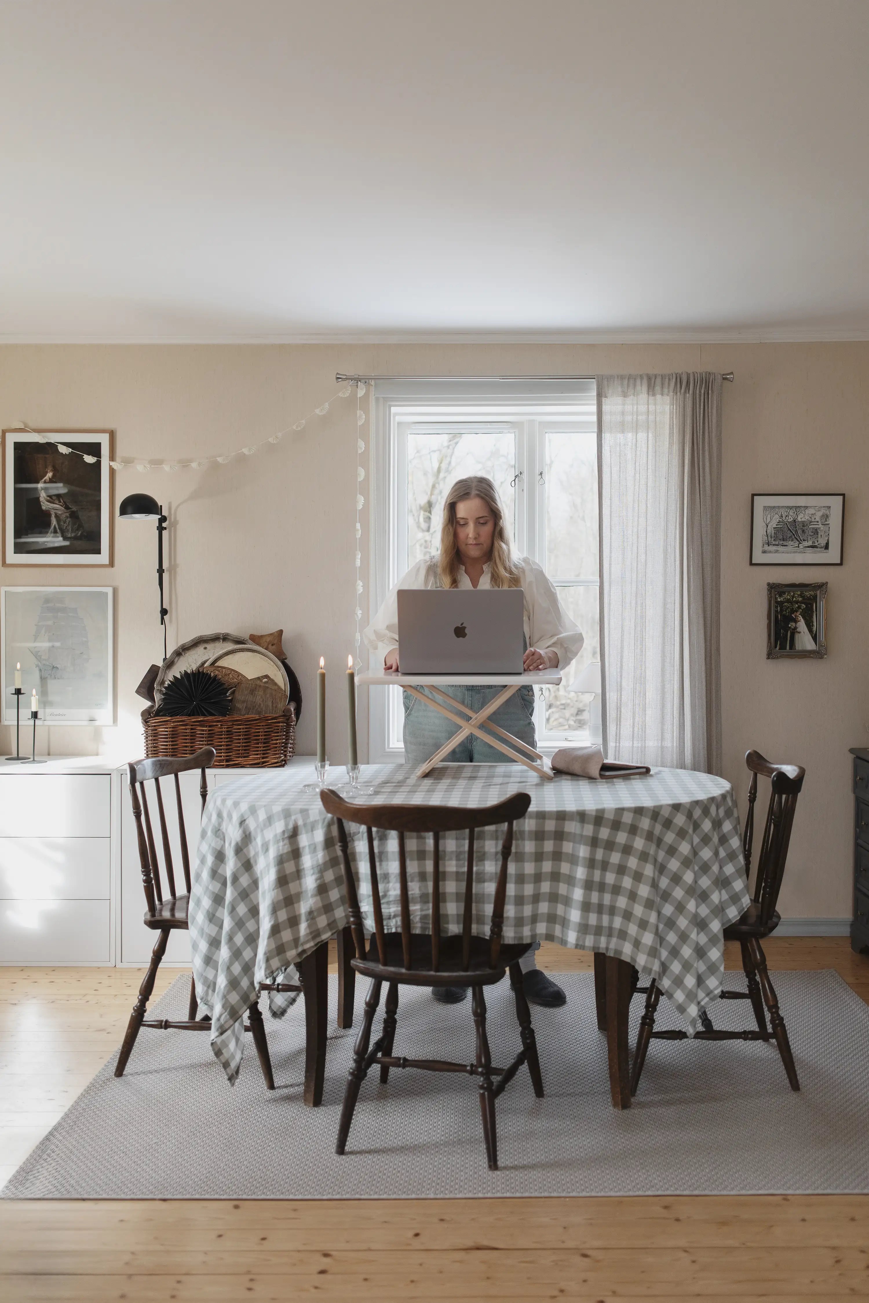Freedesk Desk Riser Original Compact on a dining table in a rustic home office setup with laptop