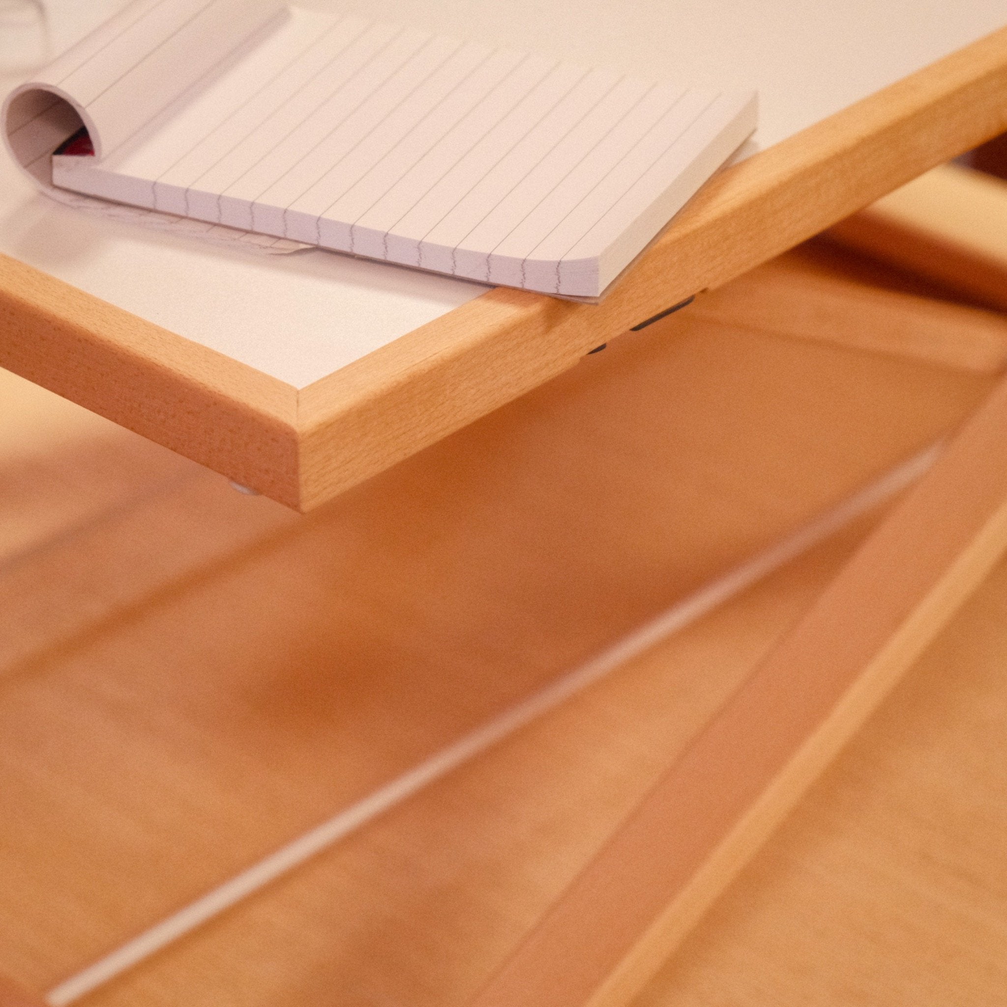 Freedesk Desk Riser Light Large on a dinner table.