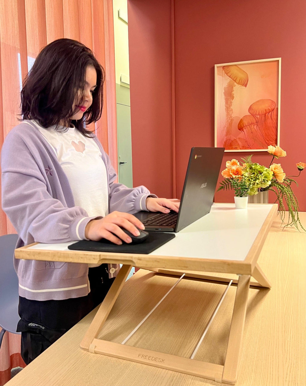 Freedesk Desk Riser Light Large on a dinner table.