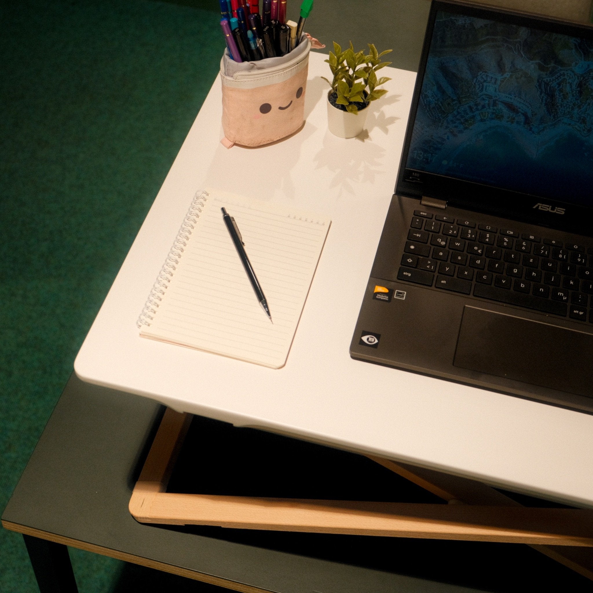 Freedesk Desk Riser Original Large on a table.