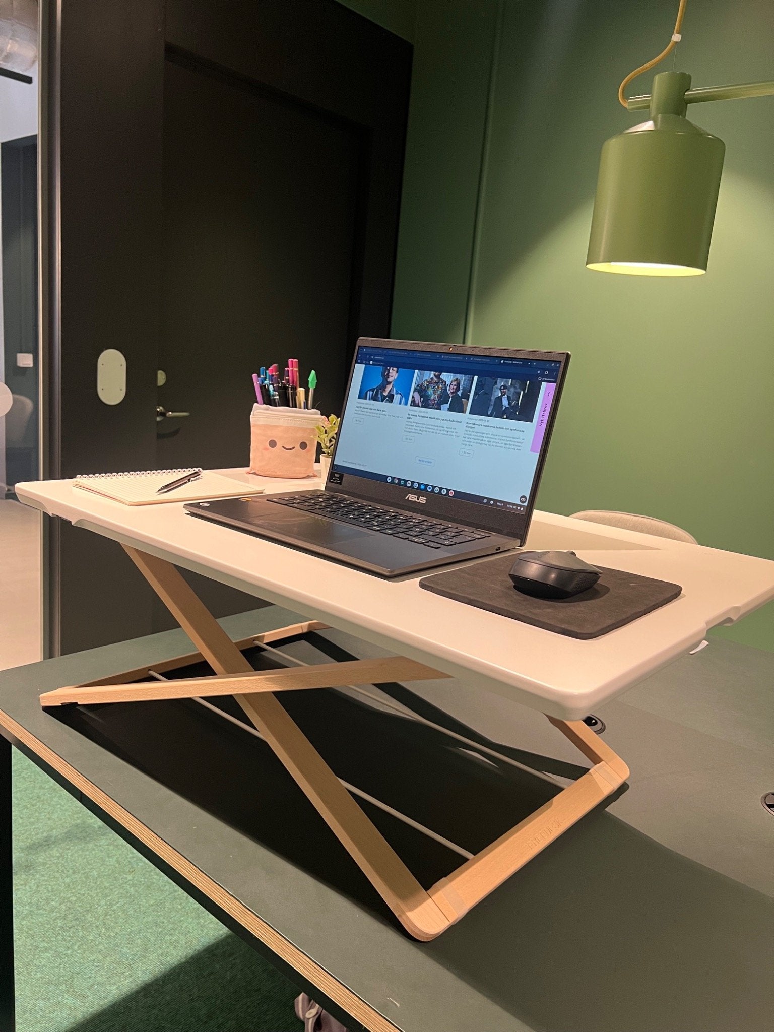 Freedesk Desk Riser Original Large on a table.