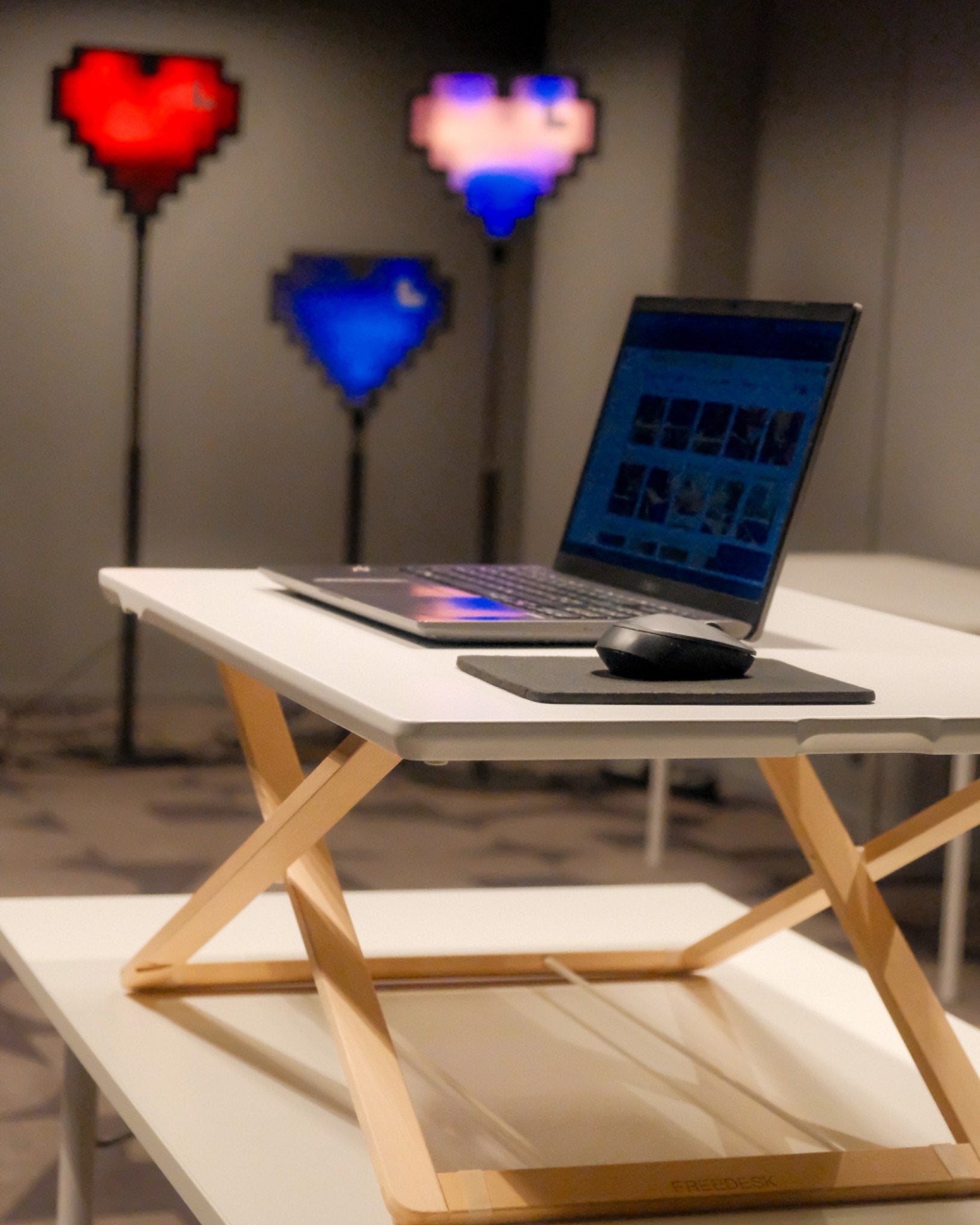 Freedesk Desk Riser Original Large on a table.