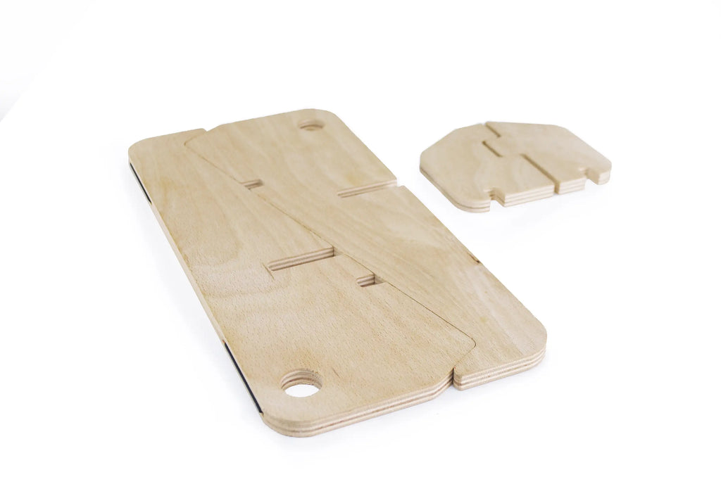 Freedesk Laptop Stand made of natural wood, laying flat unassembled showcasing its small footprint. 