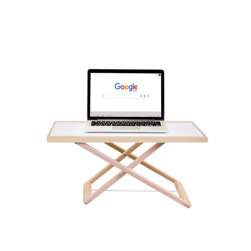 Freedesk Desk Riser Light Compact with a laptop placed on top, showing a minimalistic and sleek workspace setup.