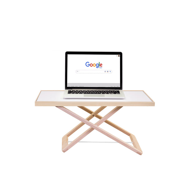 Freedesk Desk Riser Light Compact with a laptop placed on top, showing a minimalistic and sleek workspace setup.