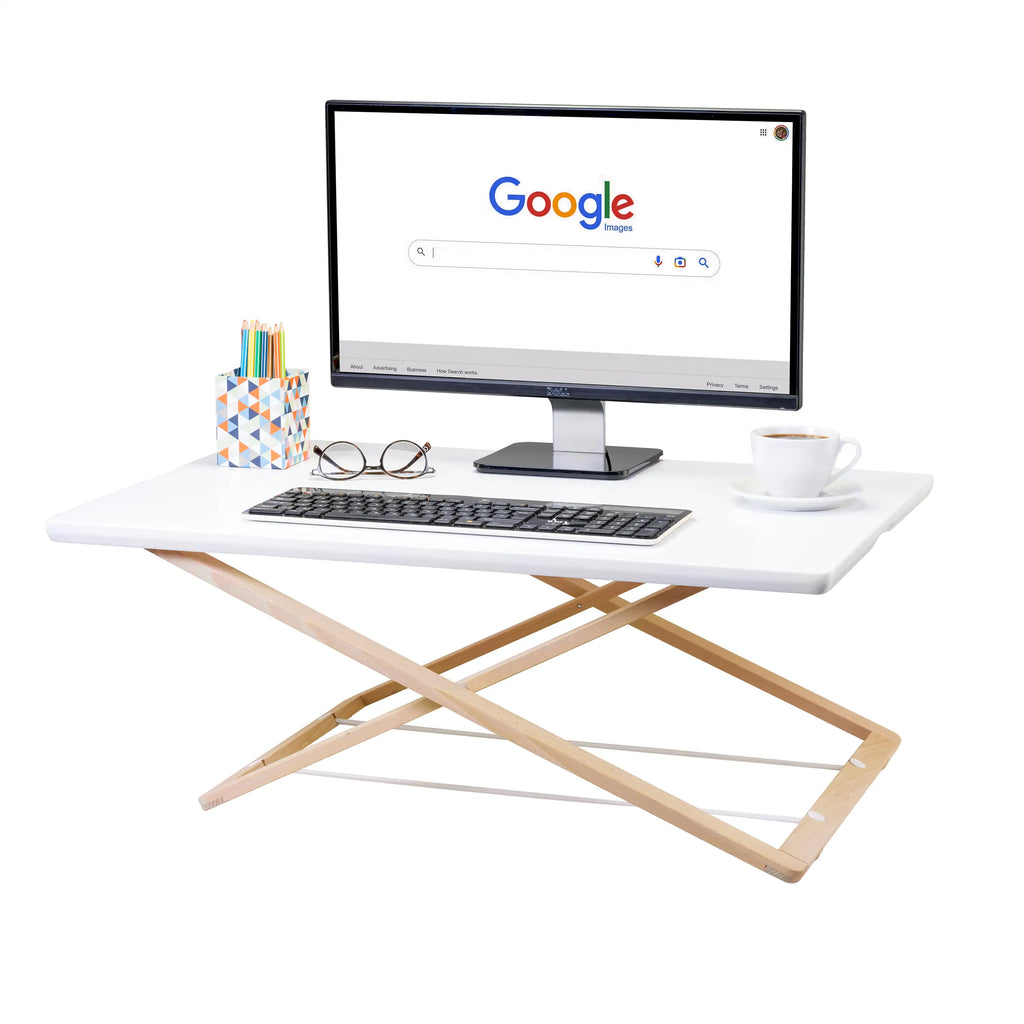 Freedesk Desk Riser Original Large with a monitor, keyboard, and coffee cup on top, showing a clean and modern workspace setup.